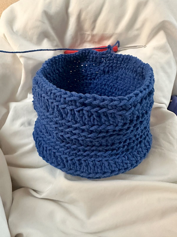 A blue crocheted basket
