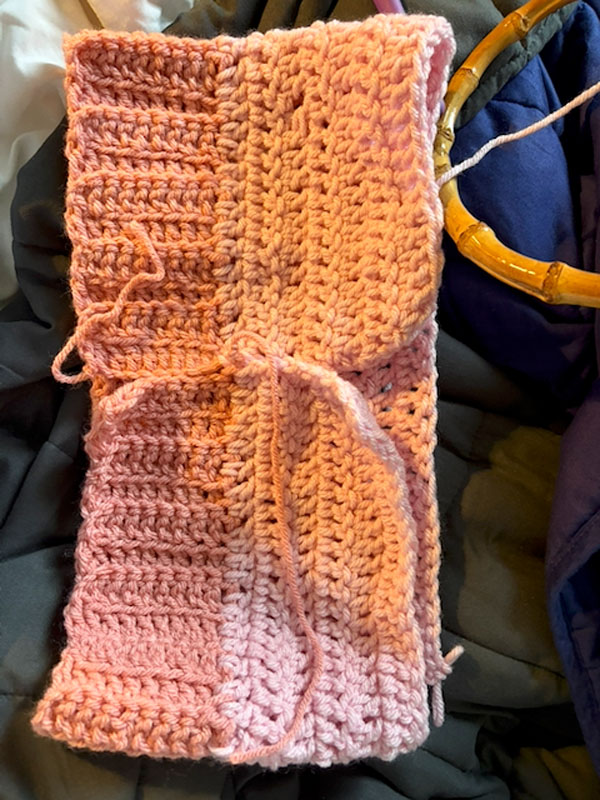 A pink crochet piece in progress